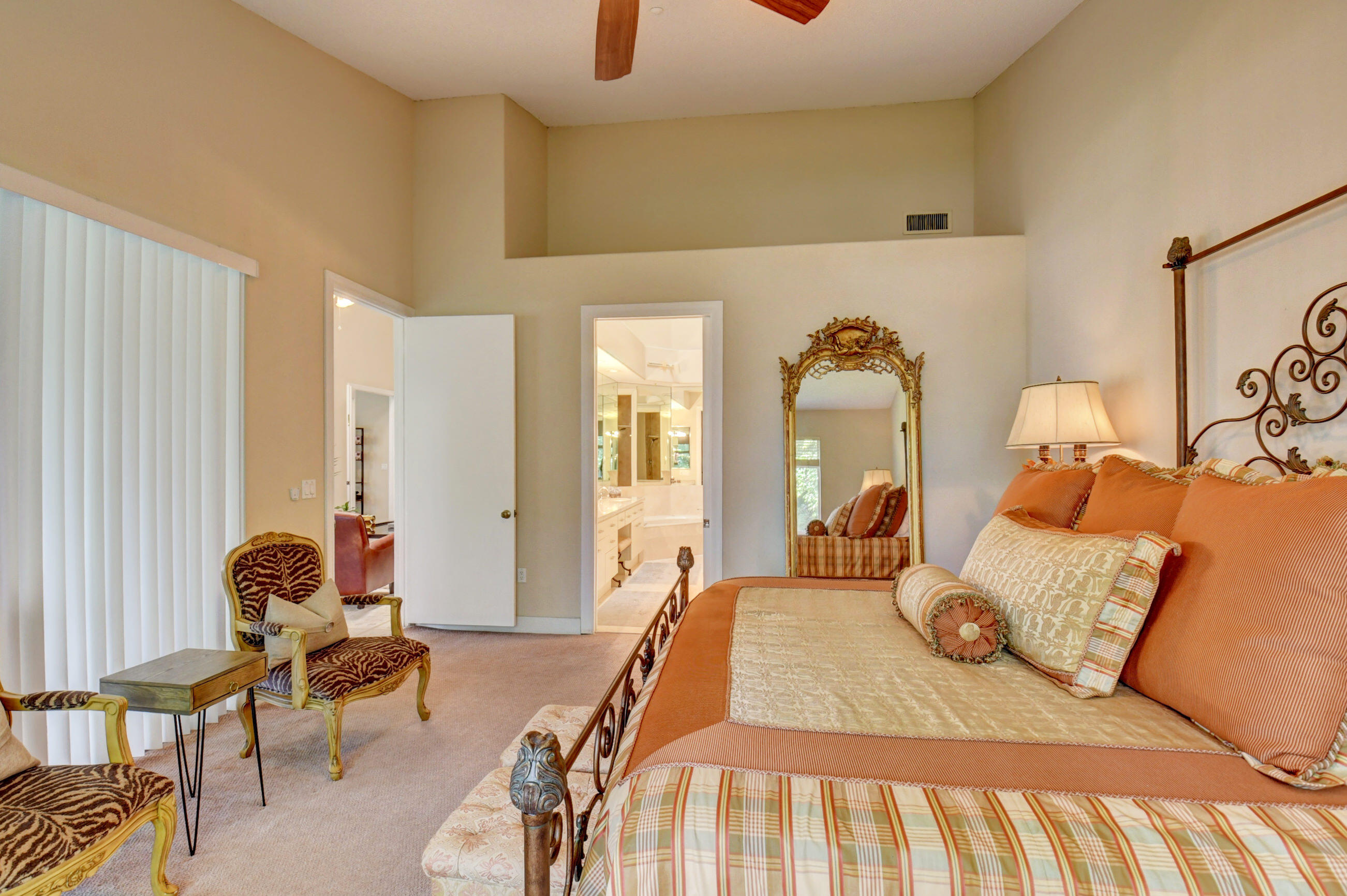 2464 Northwest 59th Street, Unit 1103 Boca Raton, FL 33496 - Photo 21 of 48 a bedroom with a bed and wooden floor