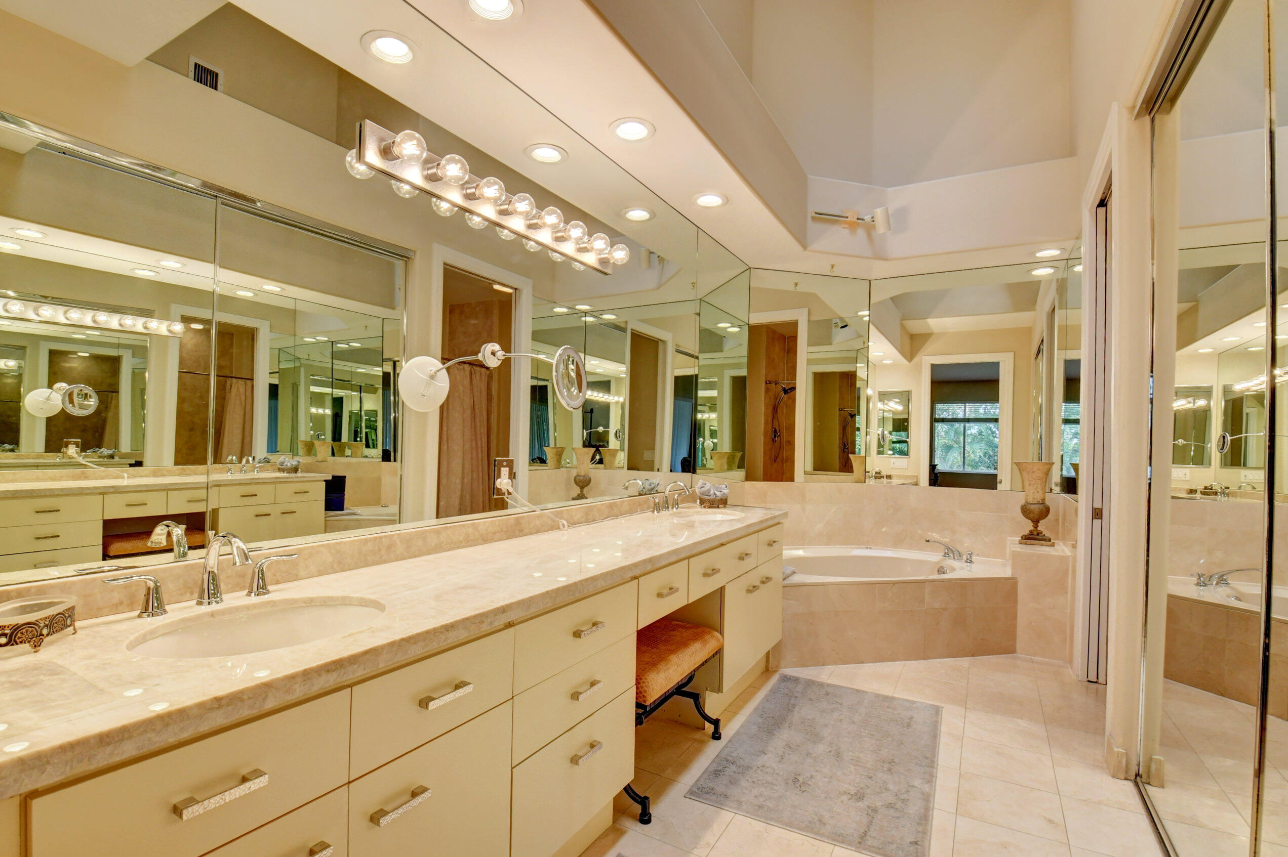 2464 Northwest 59th Street, Unit 1103 Boca Raton, FL 33496 - Photo 22 of 48 a spacious bathroom with a tub sink shower and mirror