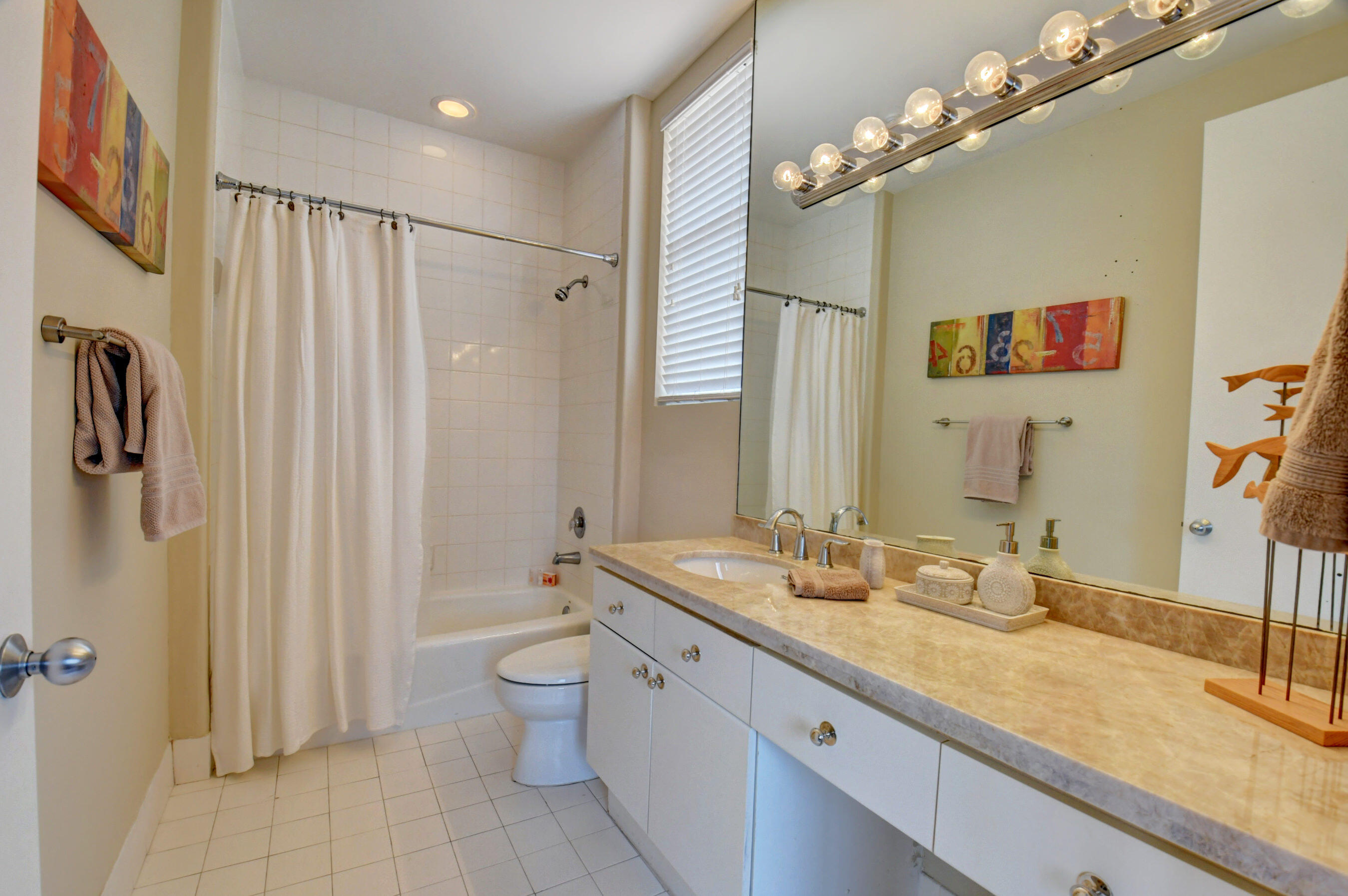 2464 Northwest 59th Street, Unit 1103 Boca Raton, FL 33496 - Photo 26 of 48 a spacious bathroom with a double vanity sink mirror and toilet
