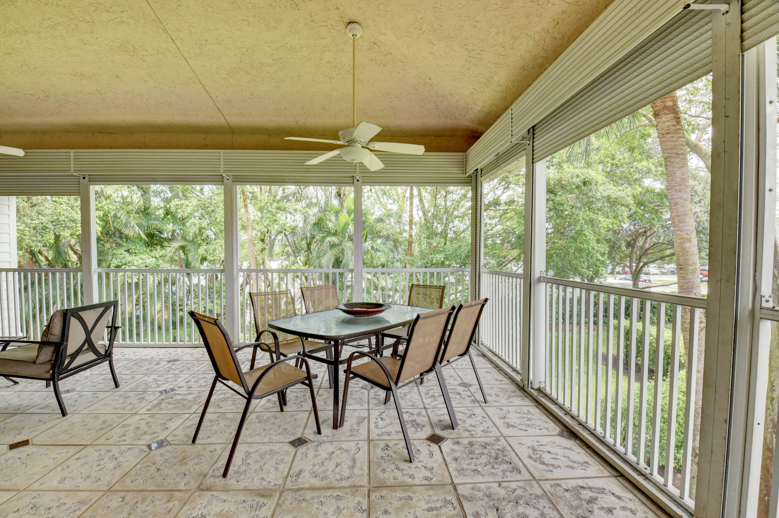 2464 Northwest 59th Street, Unit 1103 Boca Raton, FL 33496 - Photo 29 of 48 a view of a dining room with furniture window and outside view