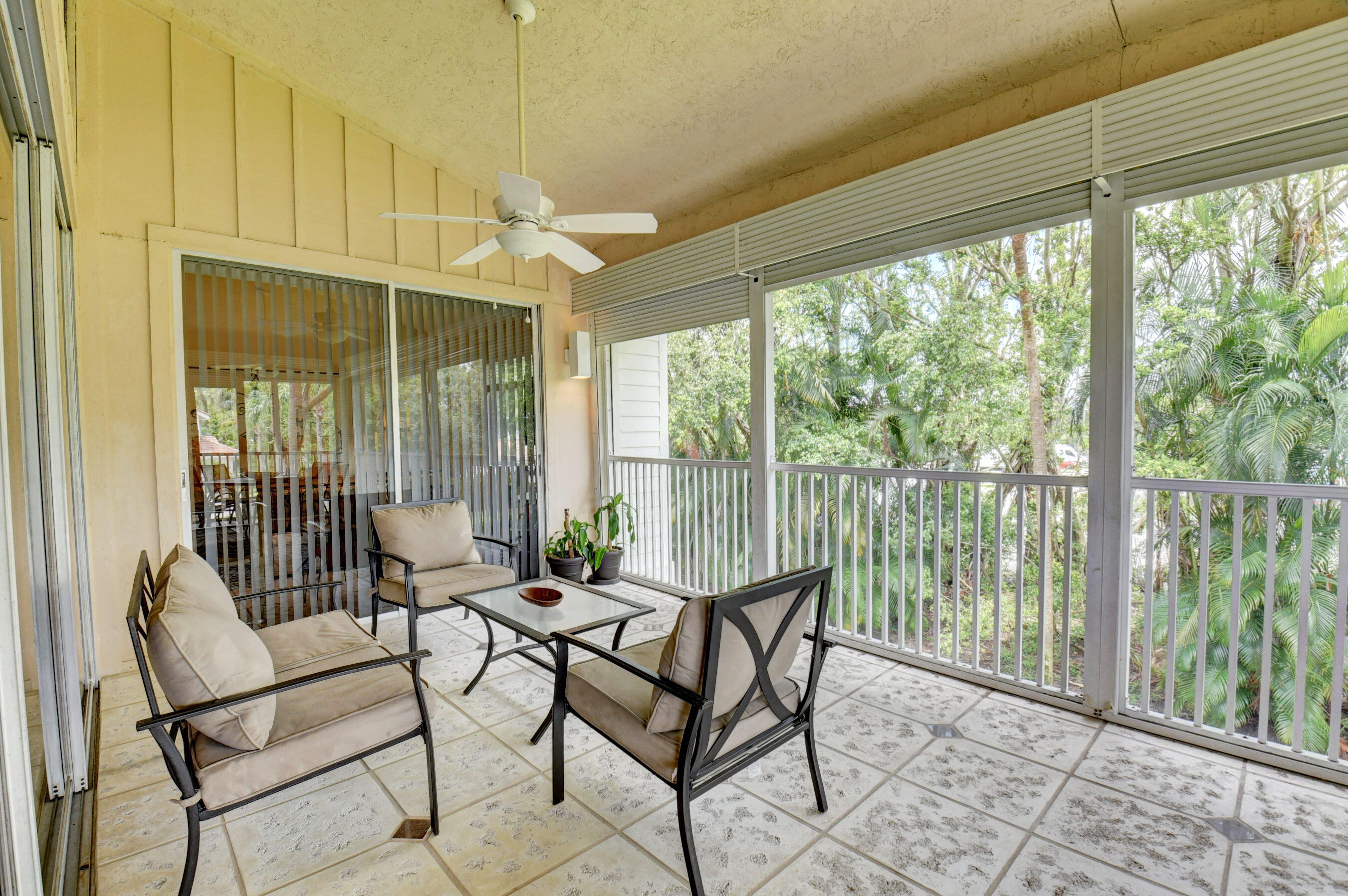 2464 Northwest 59th Street, Unit 1103 Boca Raton, FL 33496 - Photo 30 of 48 a living room with furniture and windows