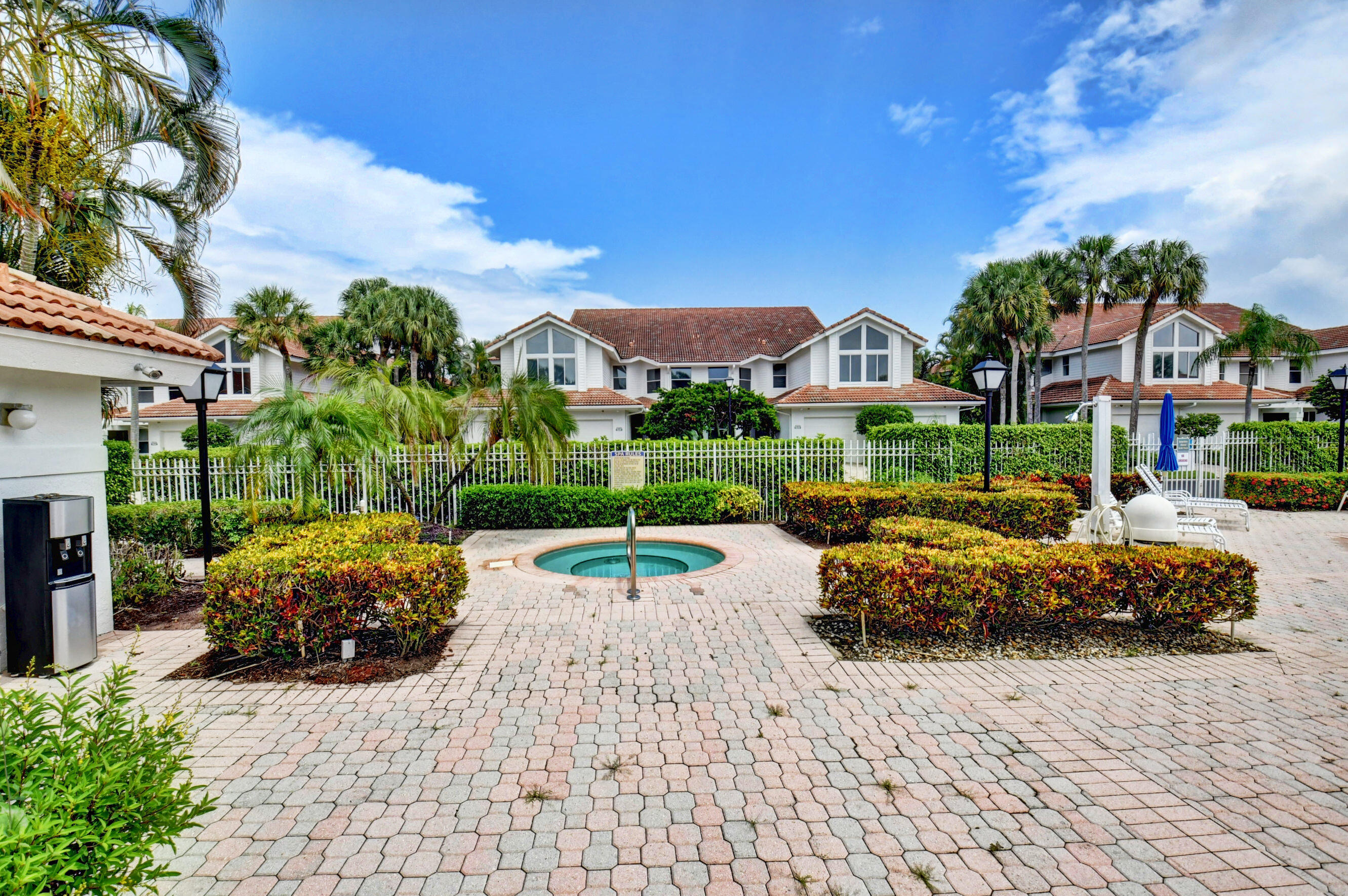2464 Northwest 59th Street, Unit 1103 Boca Raton, FL 33496 - Photo 34 of 48 a view of house with a garden and pathway