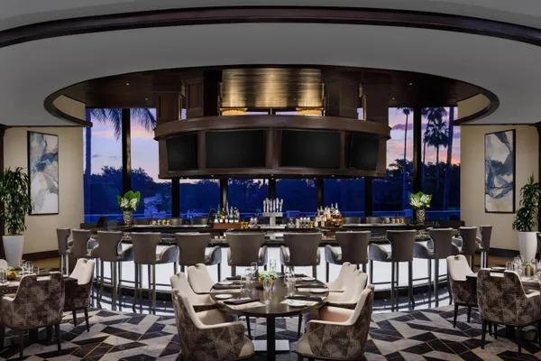 a kitchen with a table and chairs in it