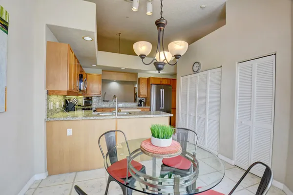 a room with dining table and chairs