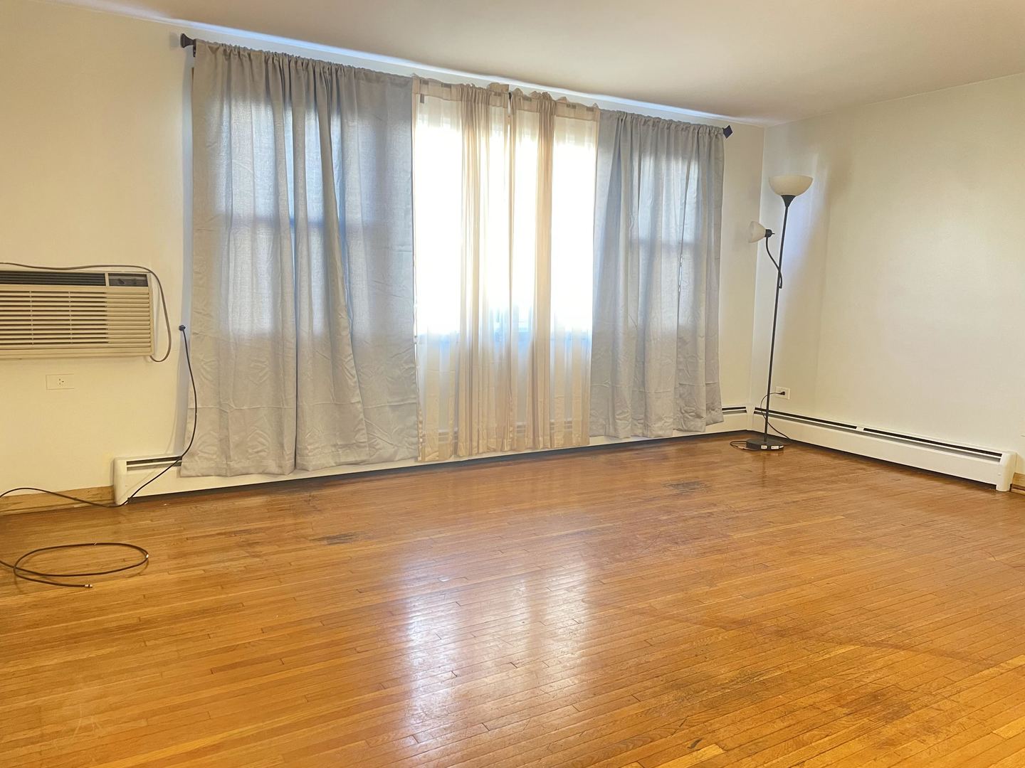 8046 South Pulaski Road Chicago, IL 60652 - Photo 4 of 9 a view of an empty room with a window