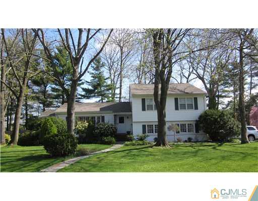 35 Clive Hills Road Edison, NJ 08820 - Photo 1 of 20 a front view of house with yard and green space