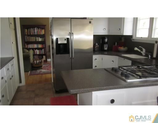 35 Clive Hills Road Edison, NJ 08820 - Photo 6 of 20 a kitchen with stainless steel appliances kitchen island a sink stove and refrigerator