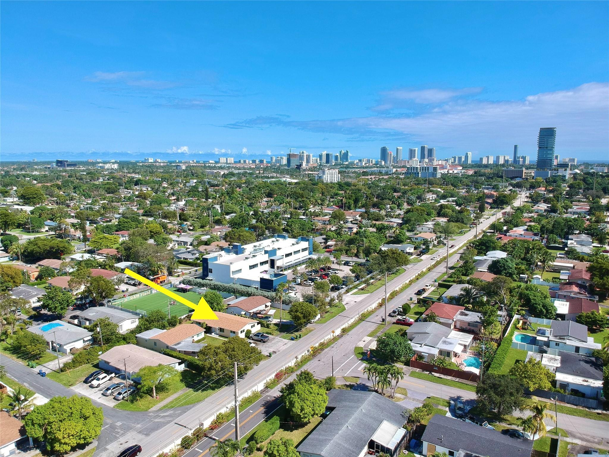 512 Southwest 11th Street, Unit A Hallandale Beach, FL 33009 - Photo 2 of 15 an aerial view of residential houses with outdoor space