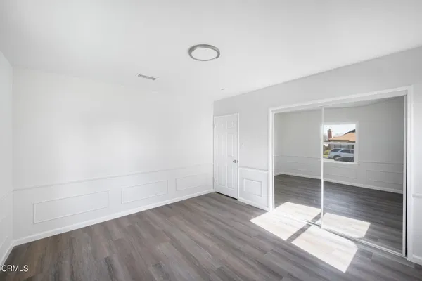 a view of cabinets and wooden floor