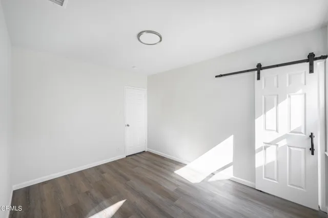 a view of an entryway with wooden floor