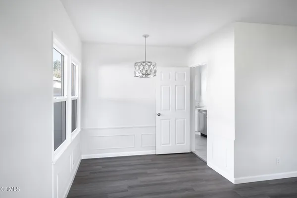 a view of an entryway with wooden floor