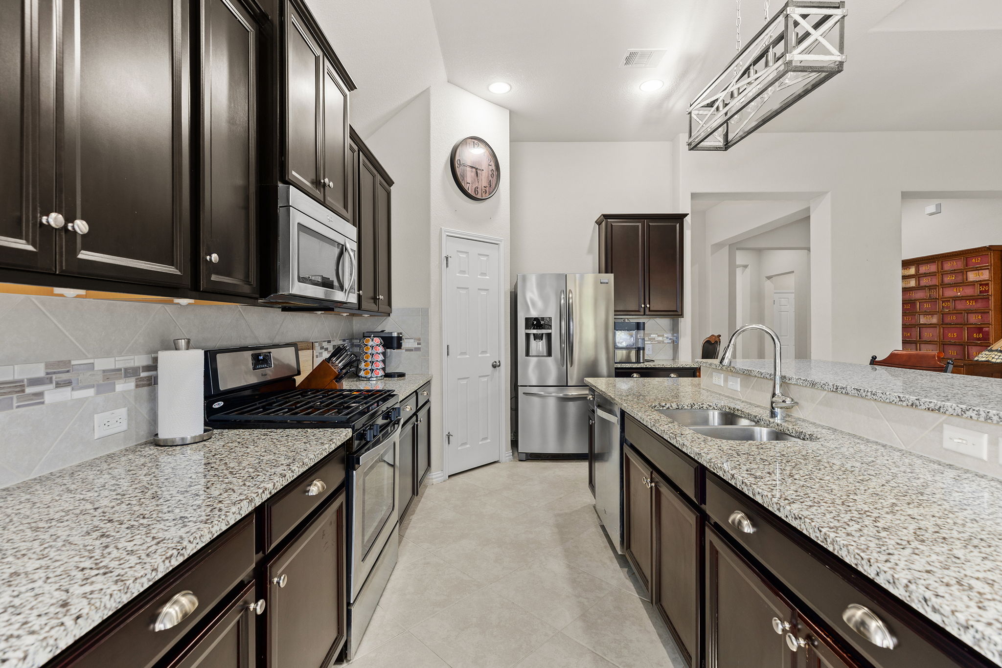 229 Sangiovese Leander, TX 78641 - Photo 4 of 37 Large open kitchen with center island/bar.