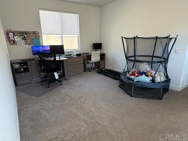 a view of a workspace with furniture