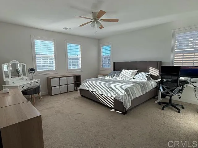 a bedroom with a bed and a table in it