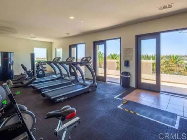 a living room with furniture a rug and a large window