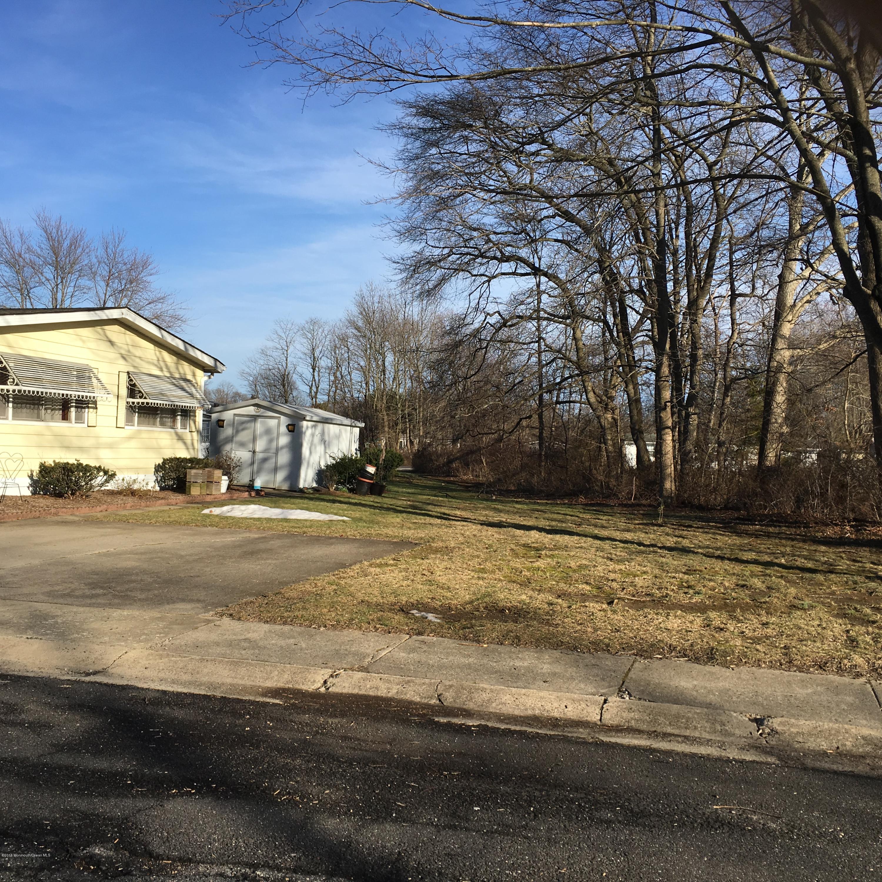 571 Cherin Road Freehold, NJ 07728 - Photo 3 of 17 a view of a street with houses