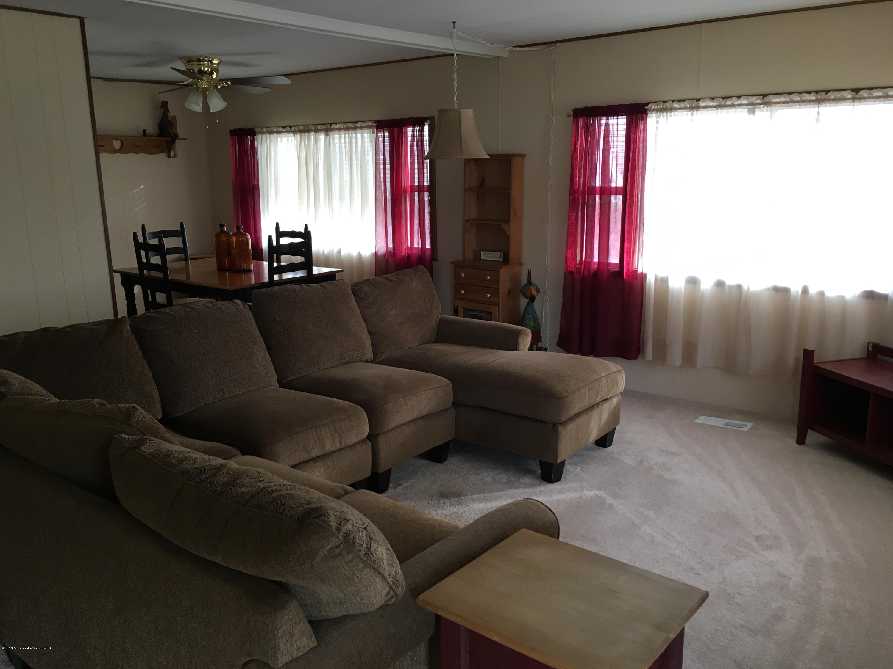 571 Cherin Road Freehold, NJ 07728 - Photo 4 of 17 a living room with furniture and a window