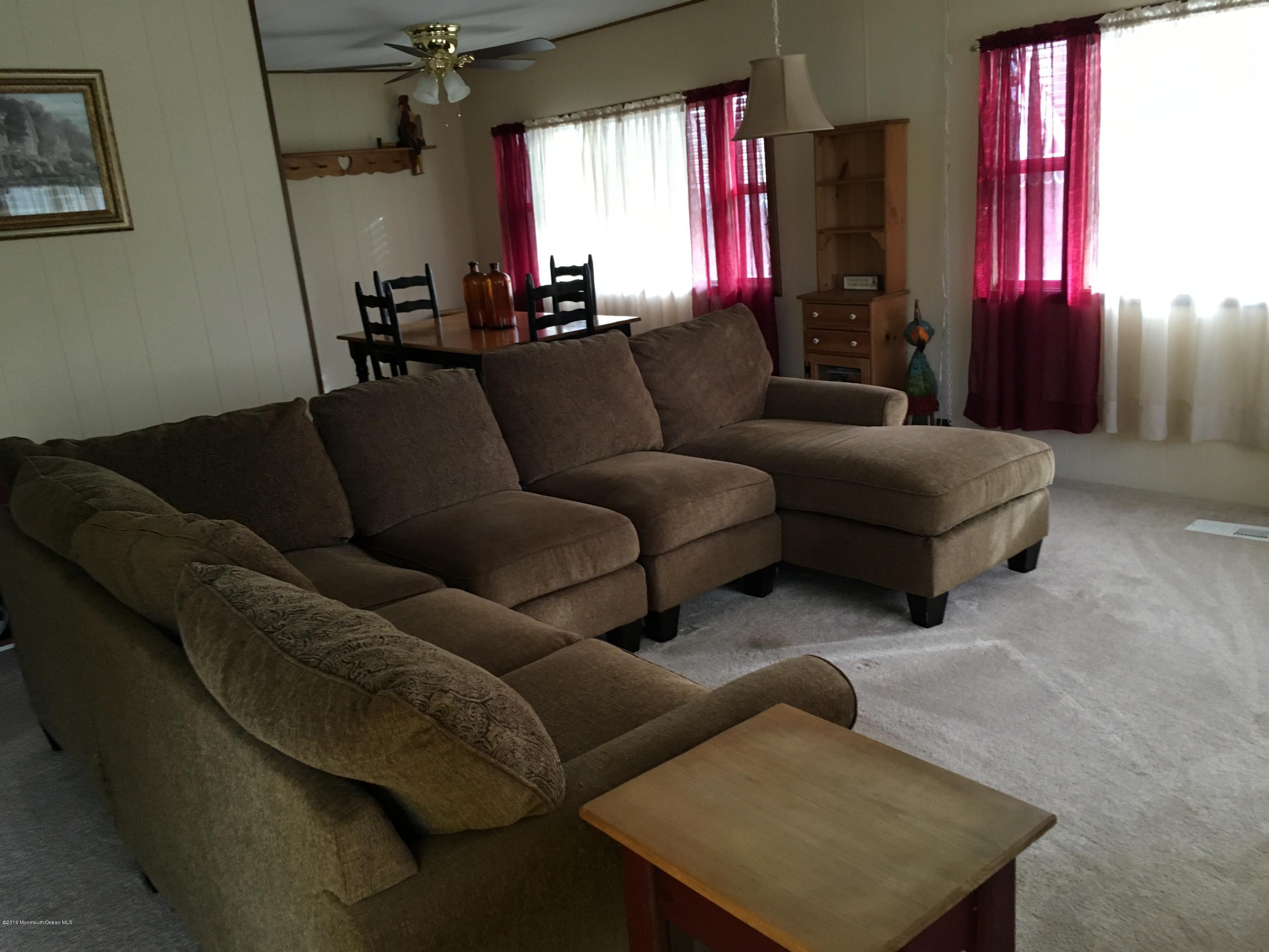 571 Cherin Road Freehold, NJ 07728 - Photo 5 of 17 a living room with furniture and a window