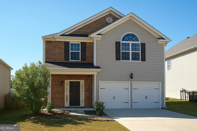 a view of a house with a small yard