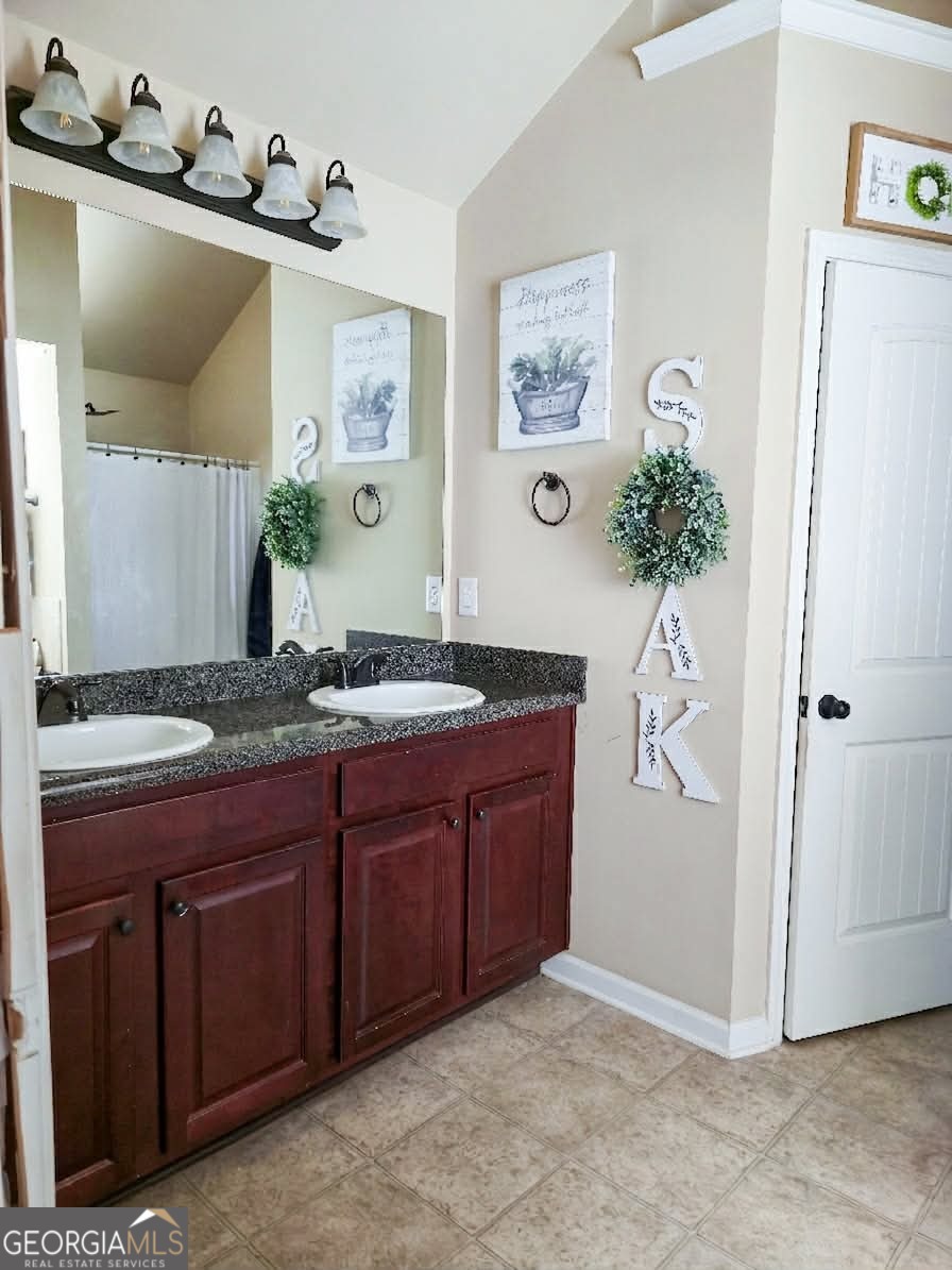2912 Wellington Street Augusta, GA 30909 - Photo 14 of 23 a spacious bathroom with a granite countertop sink and a mirror