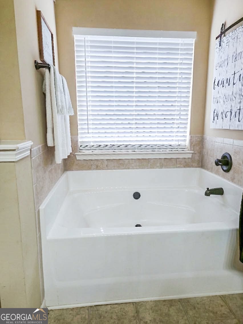 2912 Wellington Street Augusta, GA 30909 - Photo 16 of 23 a bathroom with bathtub and window