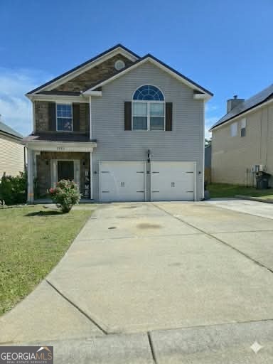 2912 Wellington Street Augusta, GA 30909 - Photo 2 of 23 a front view of a house with a yard and garage