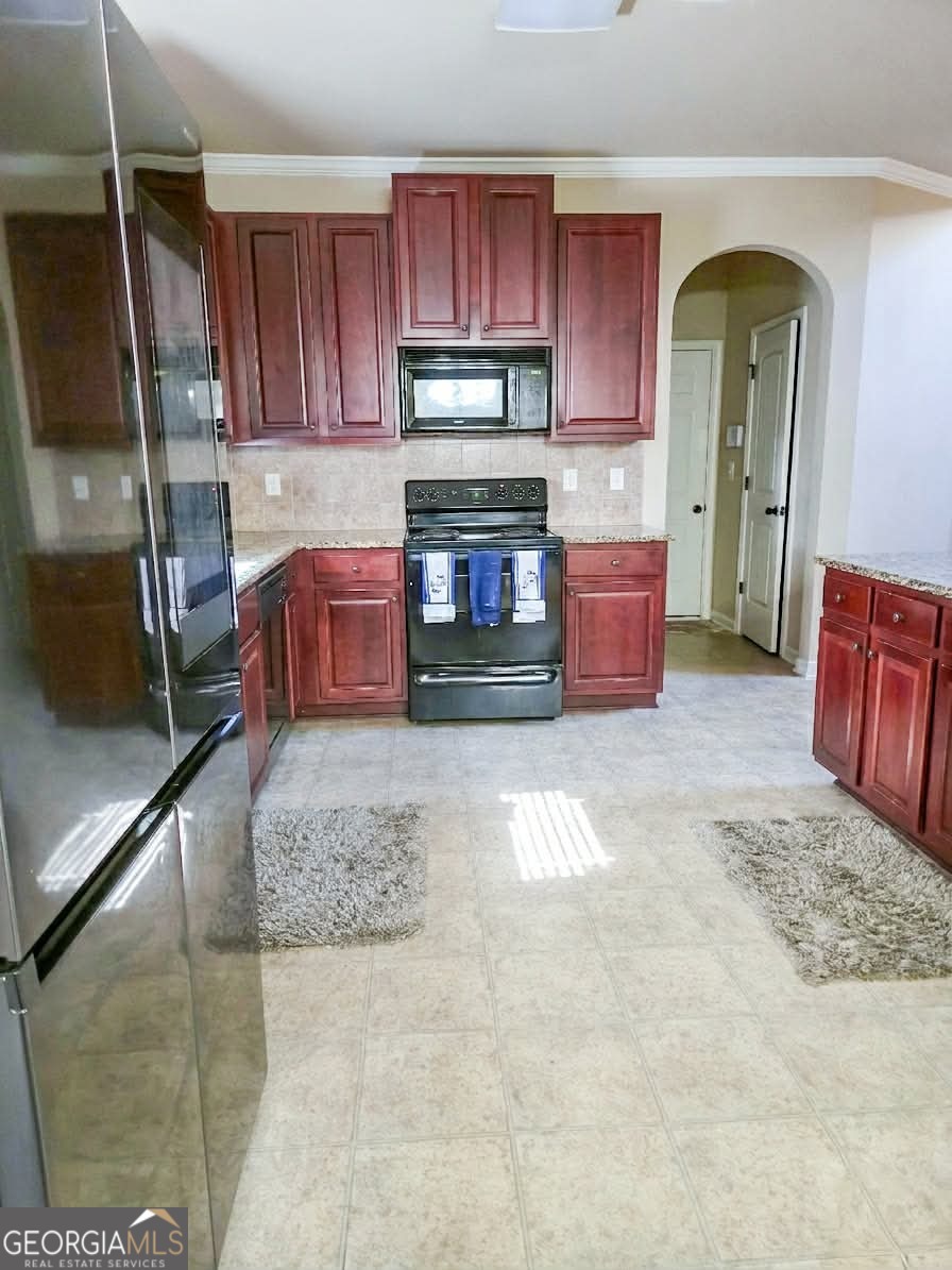 2912 Wellington Street Augusta, GA 30909 - Photo 7 of 23 a kitchen with furniture and a fireplace