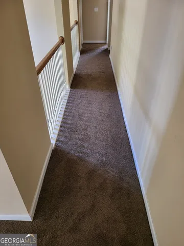 a view of a hallway with a stairs
