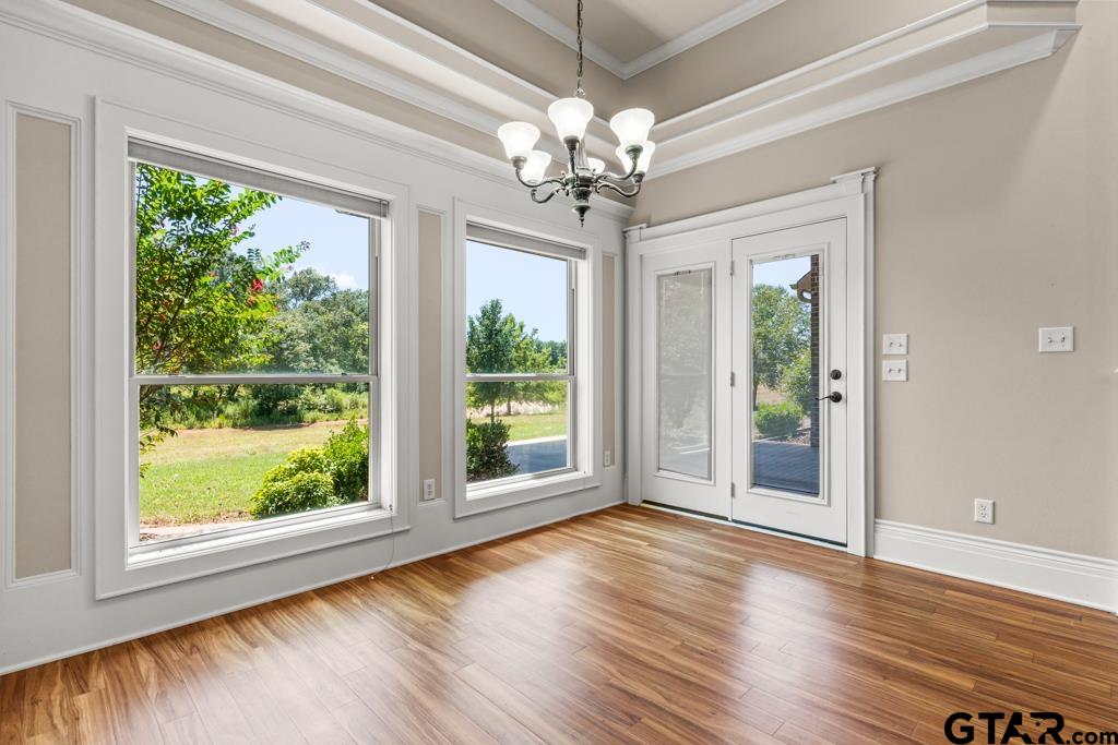 100 Lantana Road Gilmer, TX 75644 - Photo 15 of 30 a view of an empty room with wooden floor and a window