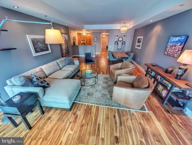 a living room with furniture and a rug