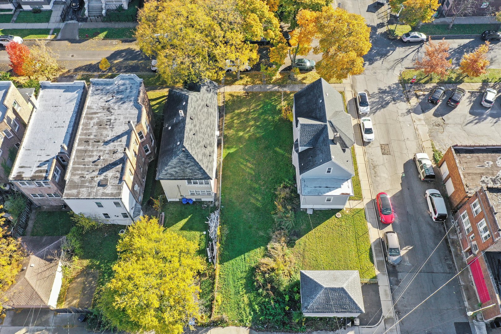11442 South Prairie Avenue Chicago, IL 60628 - Photo 3 of 6 an aerial view of residential houses with outdoor space