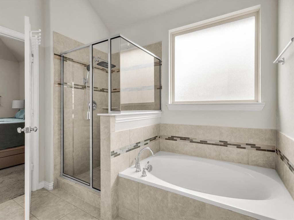 916 Monarch Lane Celina, TX 75009 - Photo 15 of 26 a white bath tub sitting next to a shower