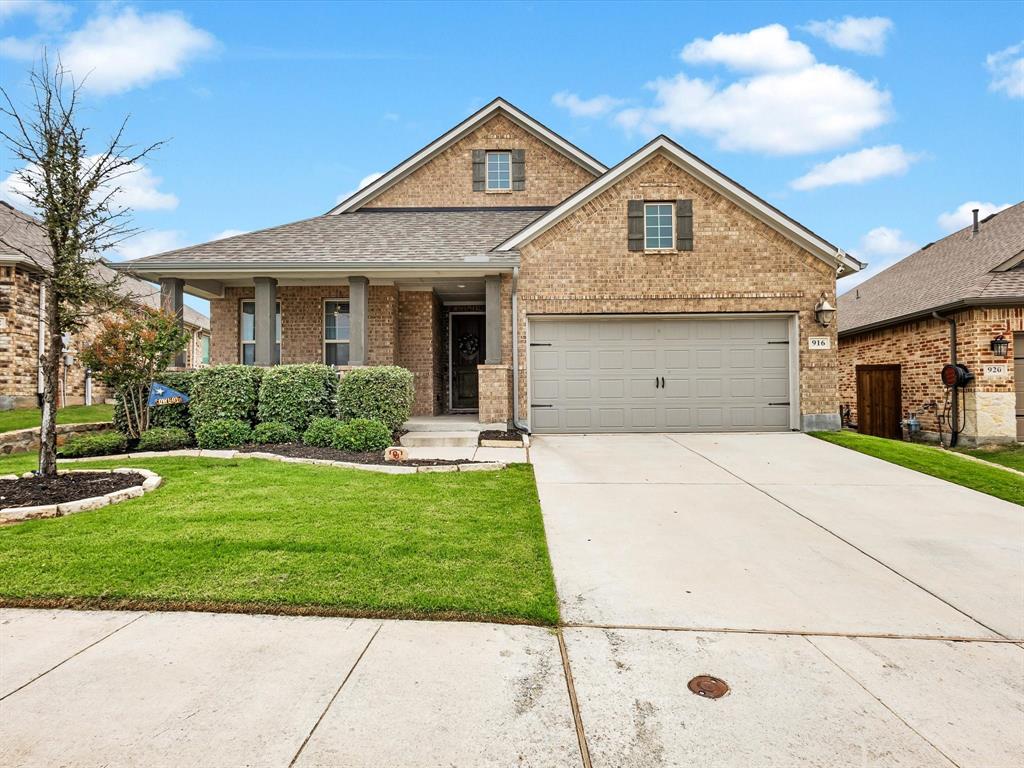 916 Monarch Lane Celina, TX 75009 - Photo 2 of 26 a front view of a house with a yard