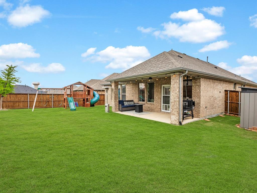916 Monarch Lane Celina, TX 75009 - Photo 24 of 26 a view of a house with backyard