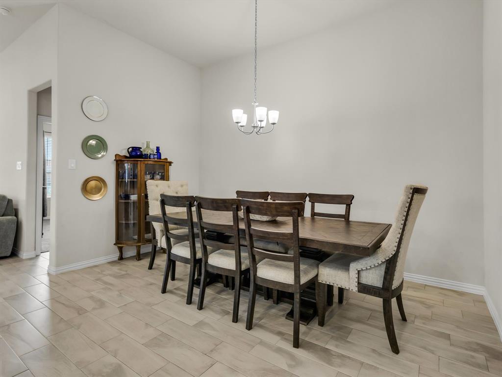 916 Monarch Lane Celina, TX 75009 - Photo 9 of 26 a dining room with furniture and window