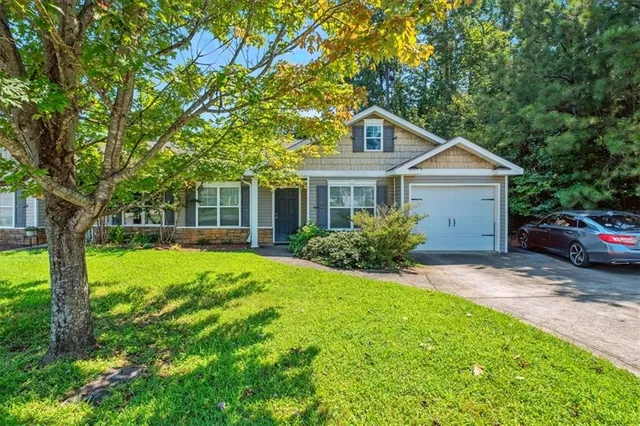 a house view with a garden space
