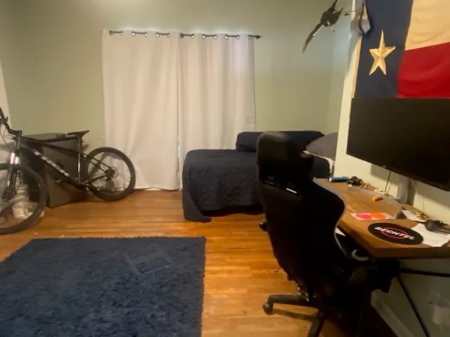 a bed sitting in a room next to a window