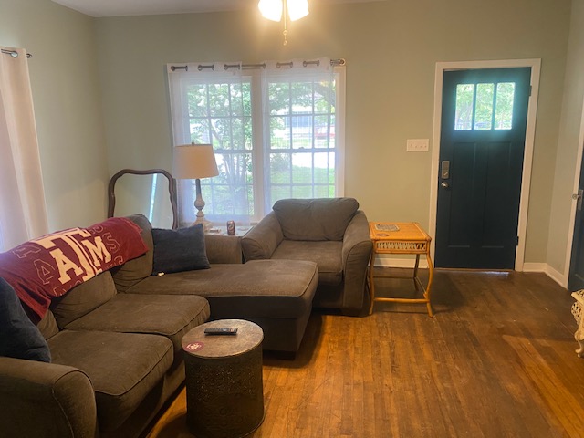 701 West 28th Street Bryan, TX 77803 - Photo 5 of 17 Living room featuring wood finished floors and baseboards
