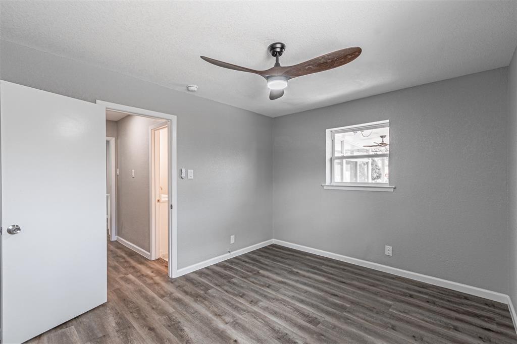 1160 Harrison Lane Hurst, TX 76053 - Photo 19 of 34 a view of empty room with wooden floor