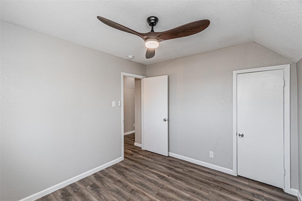 1160 Harrison Lane Hurst, TX 76053 - Photo 22 of 34 wooden floor in an empty room