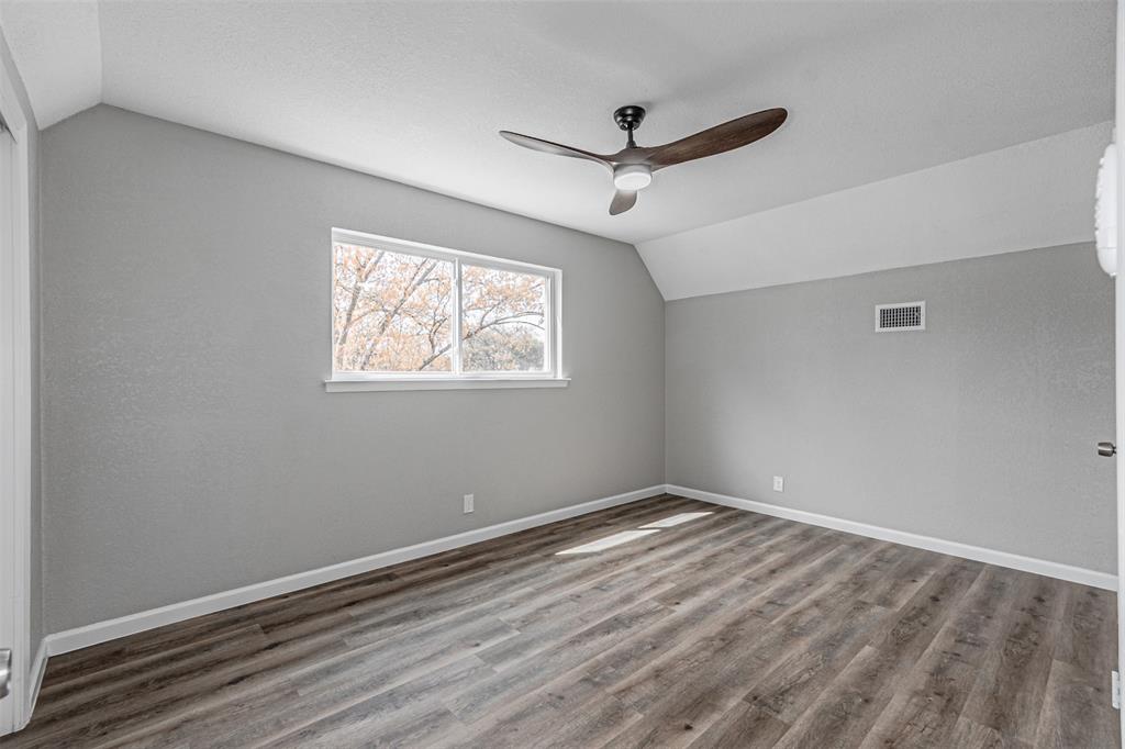 1160 Harrison Lane Hurst, TX 76053 - Photo 23 of 34 a view of room with window and ceiling fan