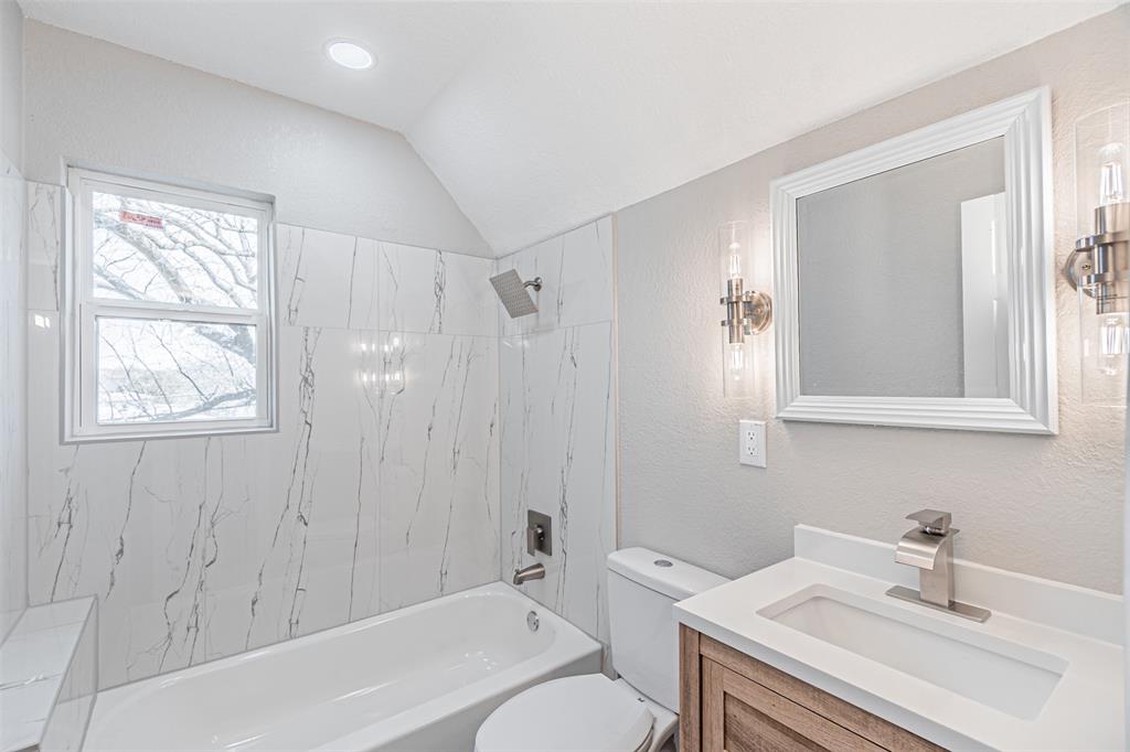 1160 Harrison Lane Hurst, TX 76053 - Photo 25 of 34 a bathroom with a sink toilet and shower