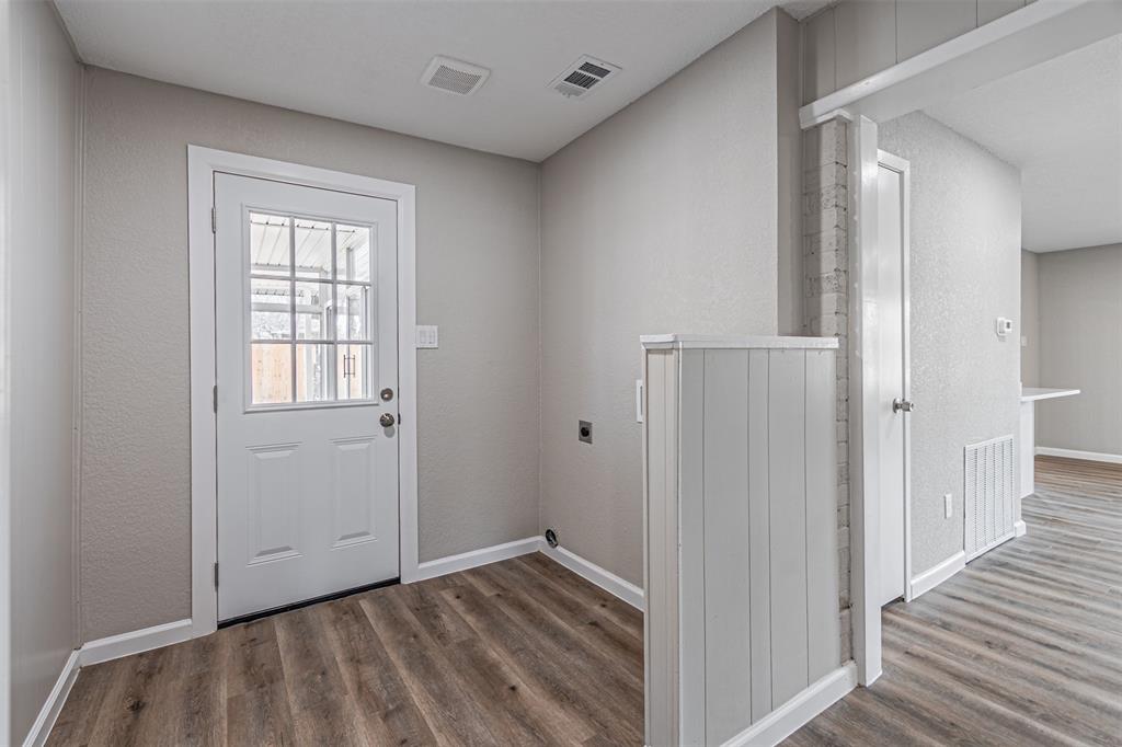 1160 Harrison Lane Hurst, TX 76053 - Photo 26 of 34 a view of hallway with wooden floor
