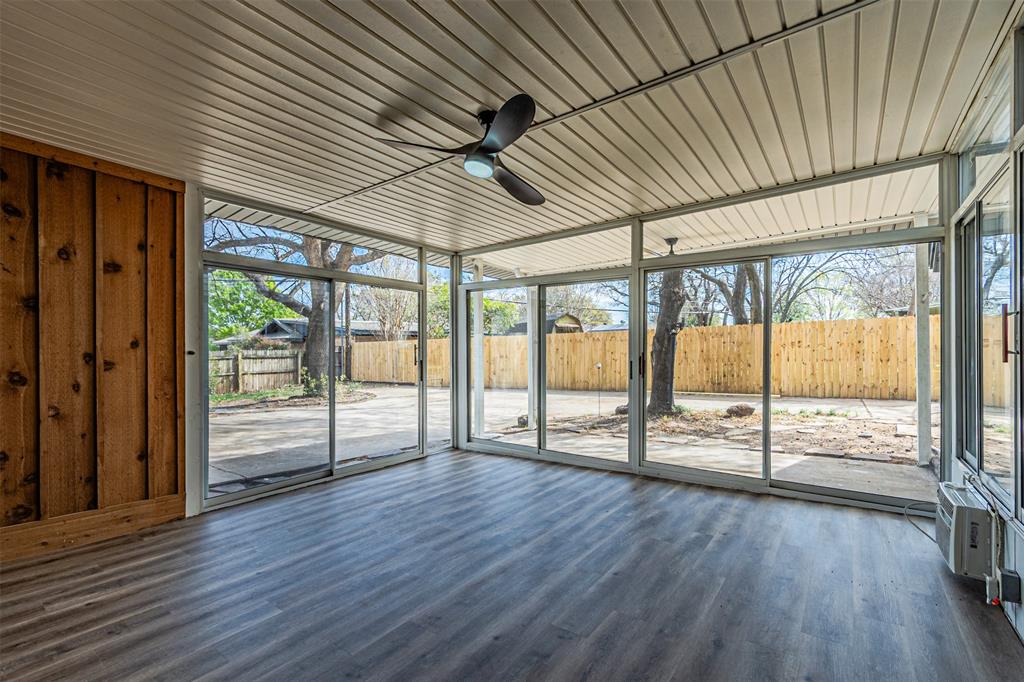 1160 Harrison Lane Hurst, TX 76053 - Photo 27 of 34 an empty room with wooden floor and balcony