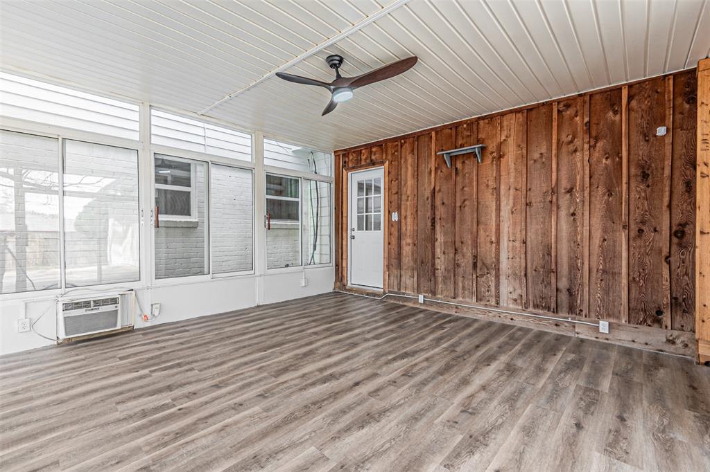 1160 Harrison Lane Hurst, TX 76053 - Photo 28 of 34 a view of an empty room with wooden floor and a window