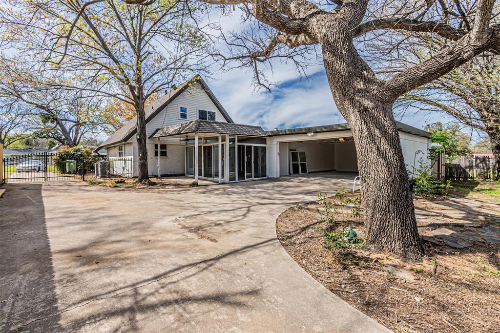 1160 Harrison Lane Hurst, TX 76053 - Photo 33 of 34 a front view of a house with a yard