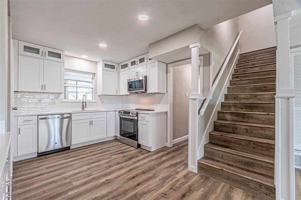 1160 Harrison Lane Hurst, TX 76053 - Photo 10 of 34 a kitchen with cabinets appliances and a window