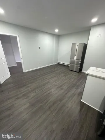 a view of a livingroom with wooden floor