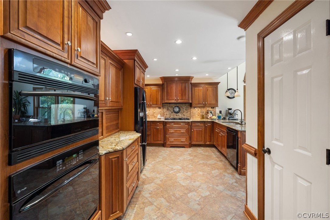 13817 Shadow Ridge Road Midlothian, VA 23112 - Photo 12 of 34 a kitchen with stainless steel appliances kitchen island granite countertop a refrigerator and a stove top oven