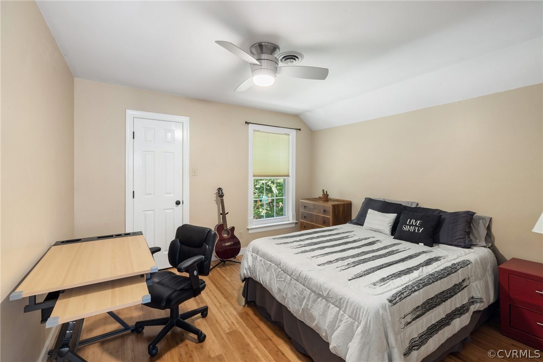 13817 Shadow Ridge Road Midlothian, VA 23112 - Photo 19 of 34 a bedroom with a bed and a chandelier
